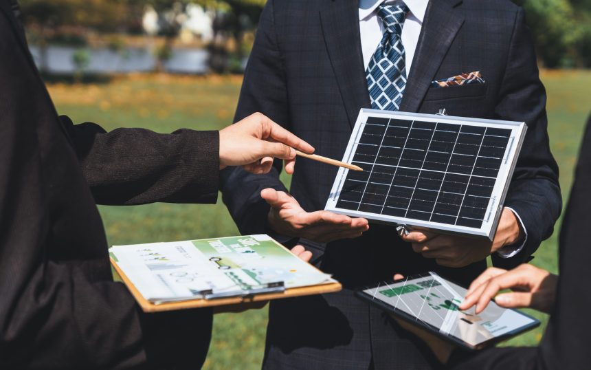 Outdoor business Outdoor business meeting on solar energy. Gyre Outdoor business meeting on solar energy, group of business people working and brainstorming on alternative energy technology utilization as corporate commitment to CSR effort. Gyre
