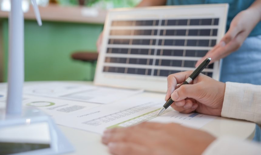 Solar panels green energy Business people working in green eco friendly office business meeting creative ideas for business eco friendly professional teaching corporate people sustainable electricity.