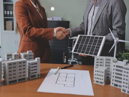 Discussion among businesspeople on the latest developments in solar cell panel technology and Solar Energy Environment city Concept.