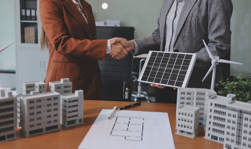 Discussion among businesspeople on the latest developments in solar cell panel technology and Solar Energy Environment city Concept.