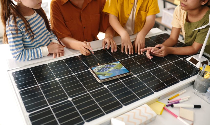 Teacher talking with kids about solar farms and renewable energy