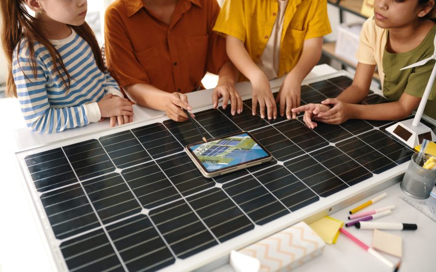 Teacher talking with kids about solar farms and renewable energy