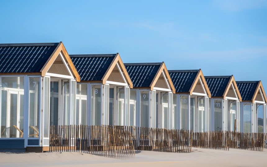 A beautiful shot of resting cabins on a sand beach